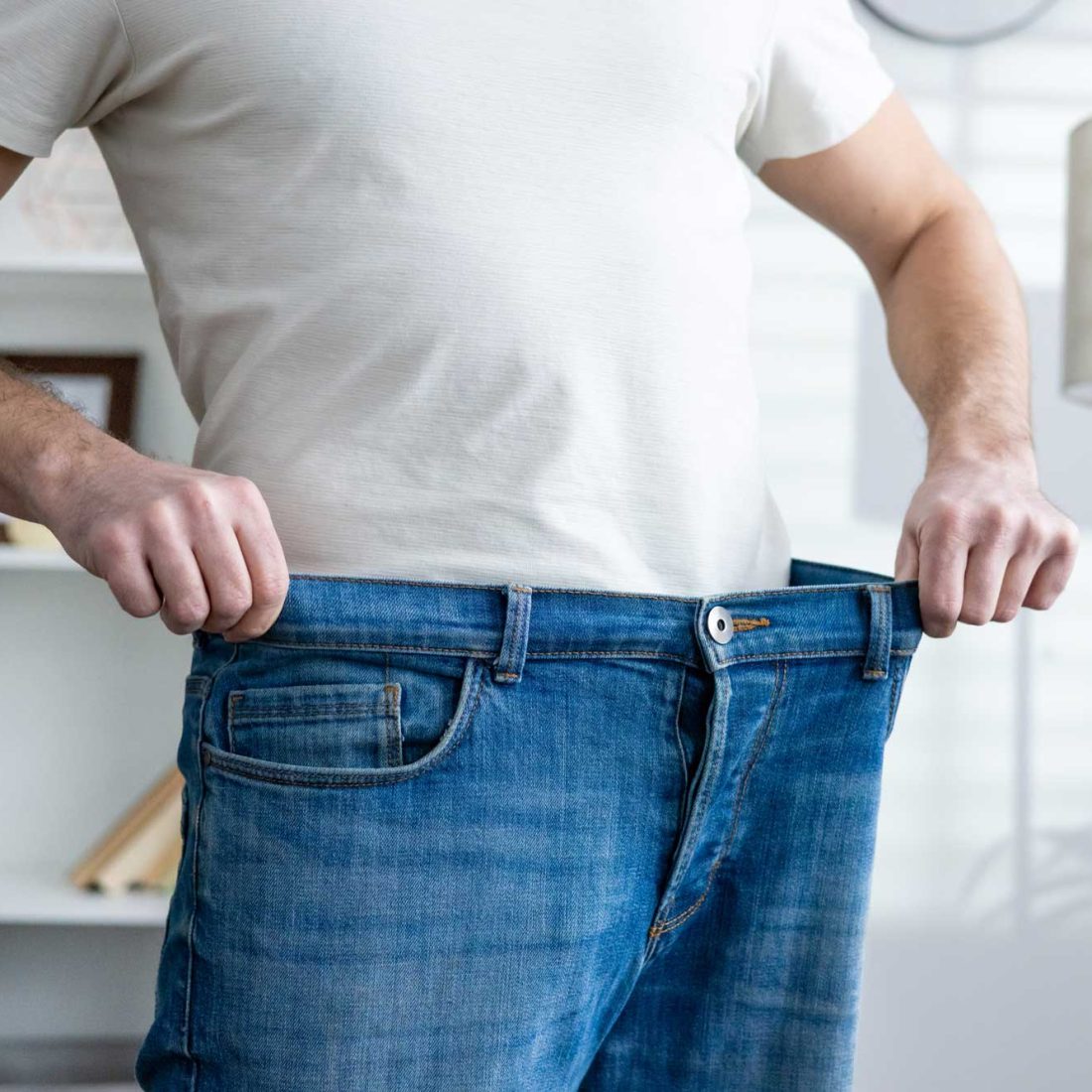 man-wearing-jeans-too-large-after-weight-loss-2026-03-24-22-00-18-utc