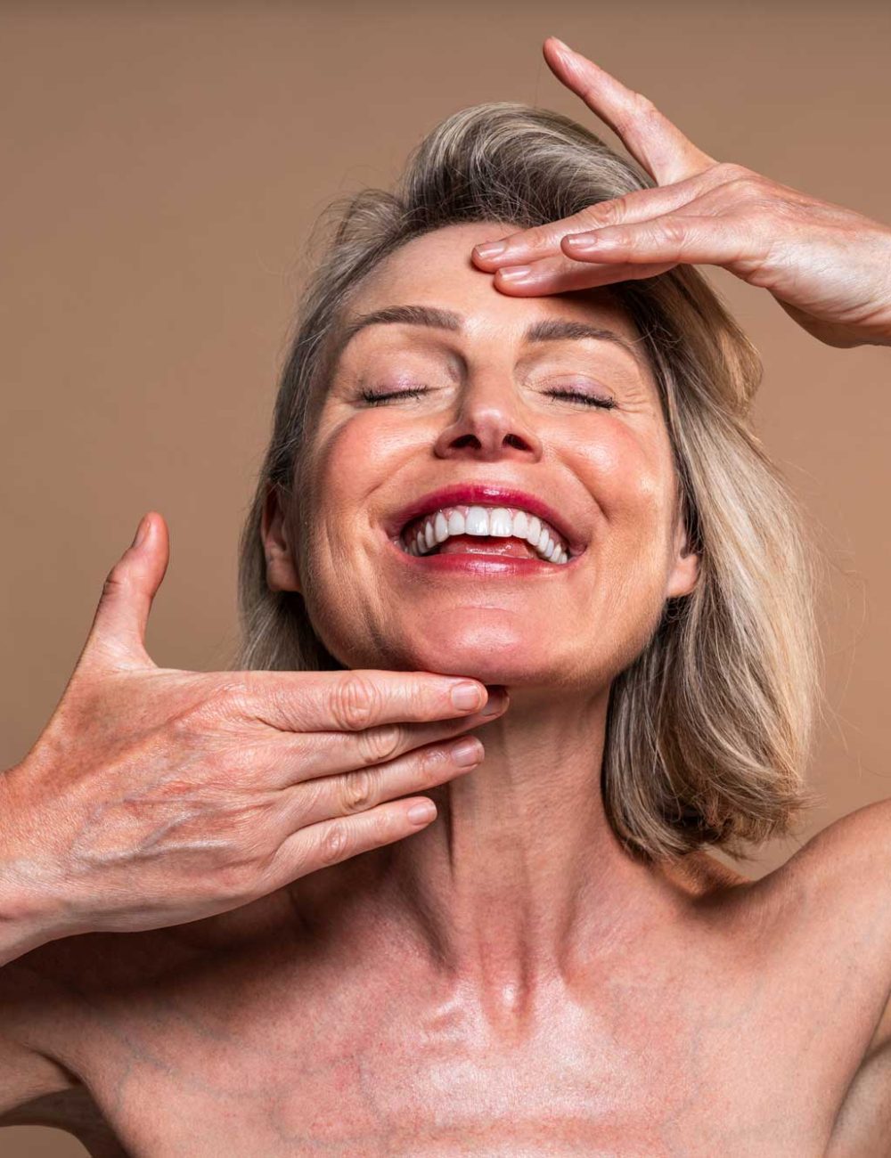 smiling-woman-with-blonde-hair-and-eyes-closed-2026-03-25-08-57-19-utc